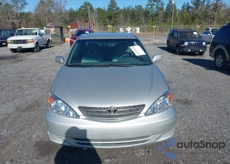 2002 Toyota Camry Le z USA, uszkodzony, nr VIN 4T1BE32KX2U117098